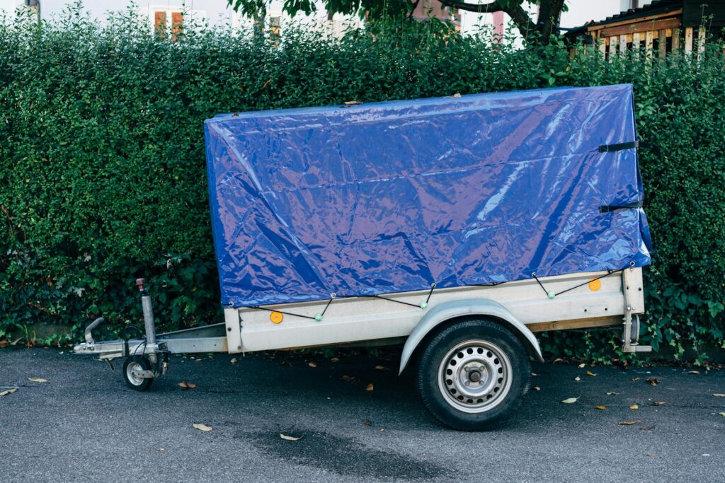 An image of a vehicle towing a trailer in heavy traffic. — prepare vehicle for towing
