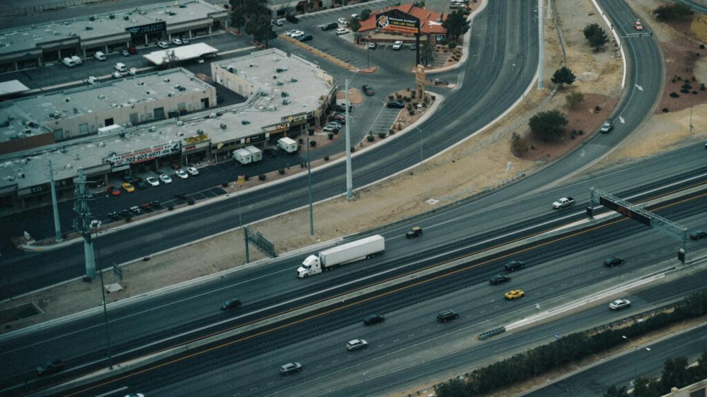 A tow truck in action on a Las Vegas highway during the day. — emergency towing Las Vegas