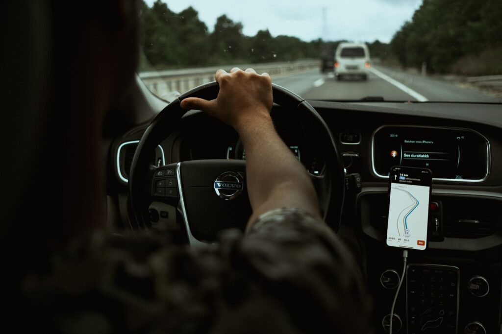 A driver using a roadside assistance app on their smartphone. — roadside assistance las vegas