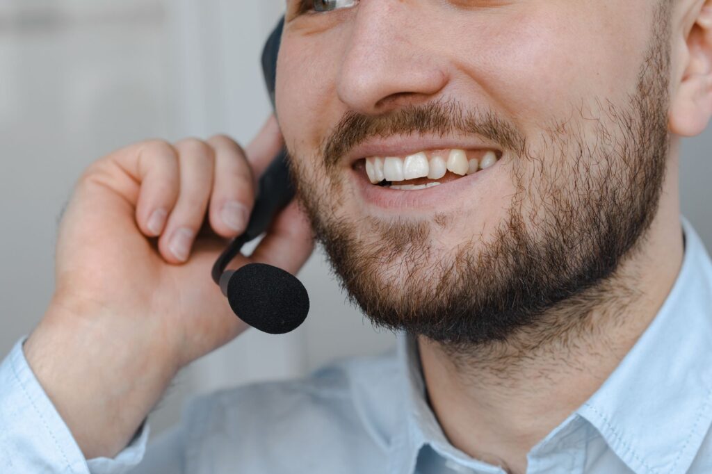A friendly local towing service representative answering a customer's questions. — local towing service Las Vegas