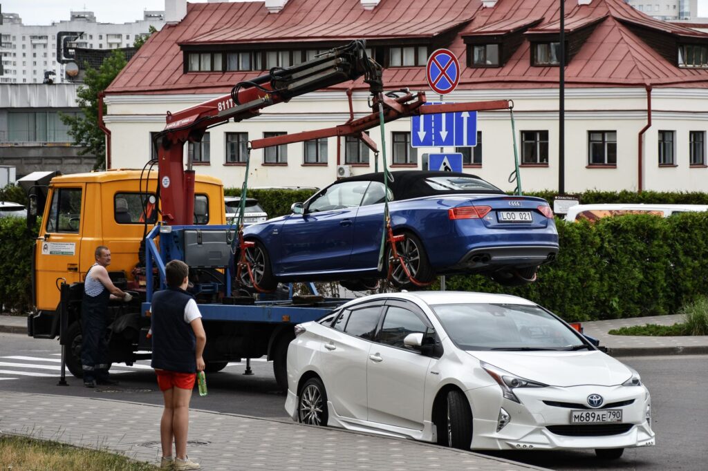 A photo of a towing truck in Las Vegas with a car being towed. — towing fees Las Vegas
