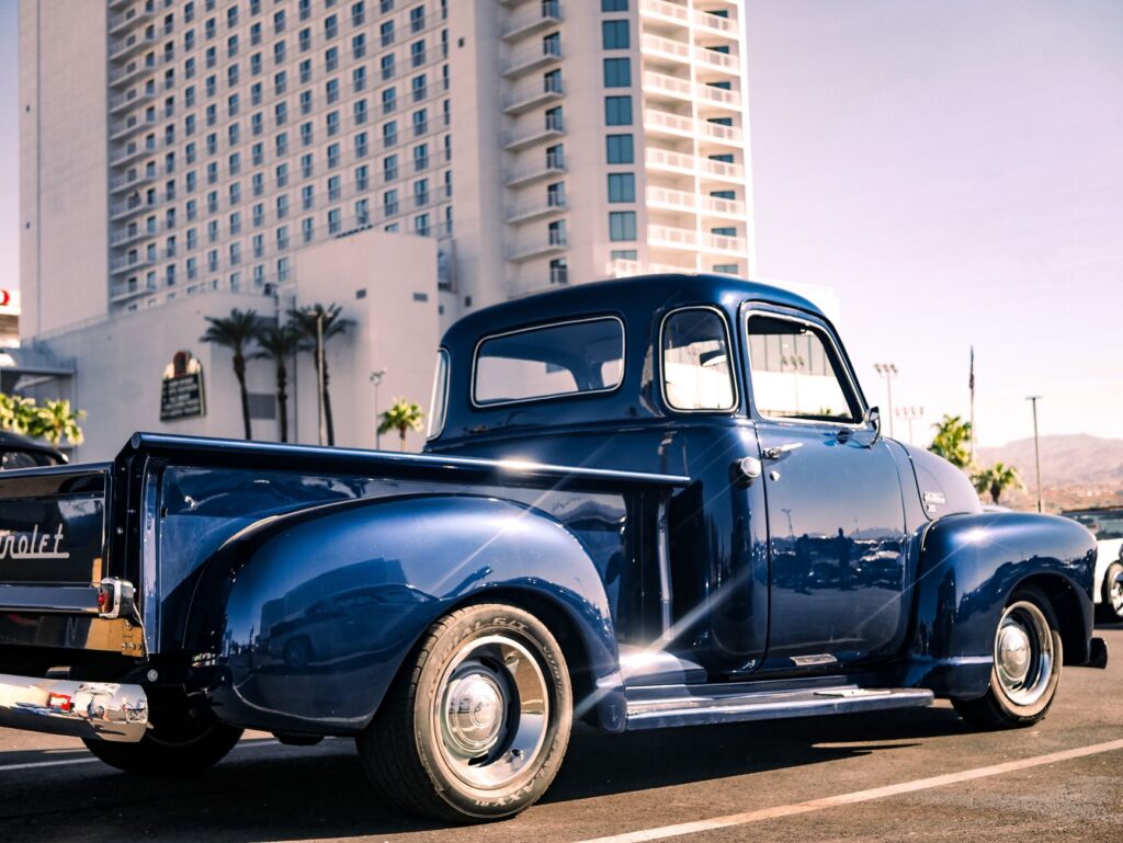 A tow truck parked on a Las Vegas street, showcasing the city skyline in the background. — cheap towing Las Vegas