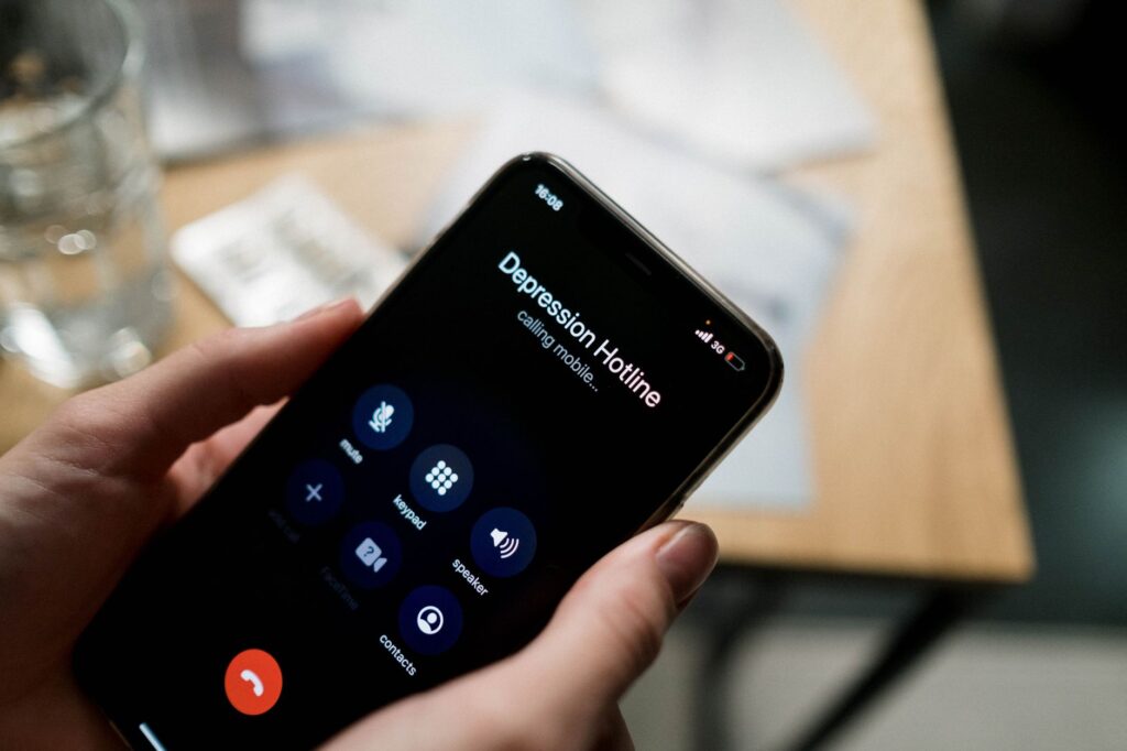 An image of a customer using their phone to call for emergency towing services. — emergency towing Las Vegas