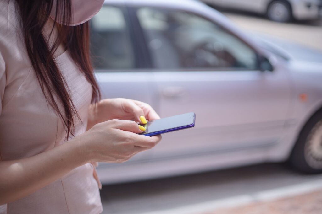An image of a person researching towing companies on a smartphone. — tow truck scam las vegas